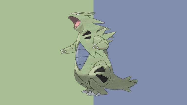 This image shows Tyranitar, a Dark and Rock type creature from Pokemon Go. It's a khaki-colored dinosaur with blue and black accents, as well as spikes coming from its body.