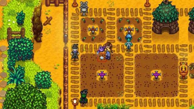 The player watering some crops in Stardew Valley.