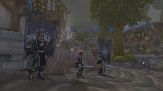 The Argent Crusade fights back the scourge in WoW Wrath Classic. Pictured are three Argent Crusaders in Stormwind City.