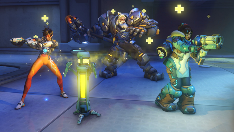 Tracer, Reinhardt, and Mei stand on a snowy field and receive healing.