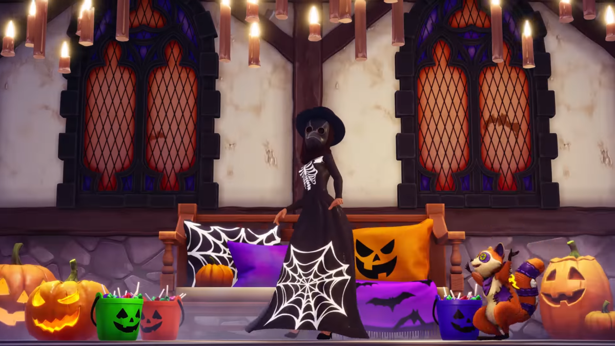 The player wearing a spiderweb dress and a Plague mask while standing in a room with a spooky pumpkin couch, a toy raccoon companion, and many candy buckets and pumpkins.