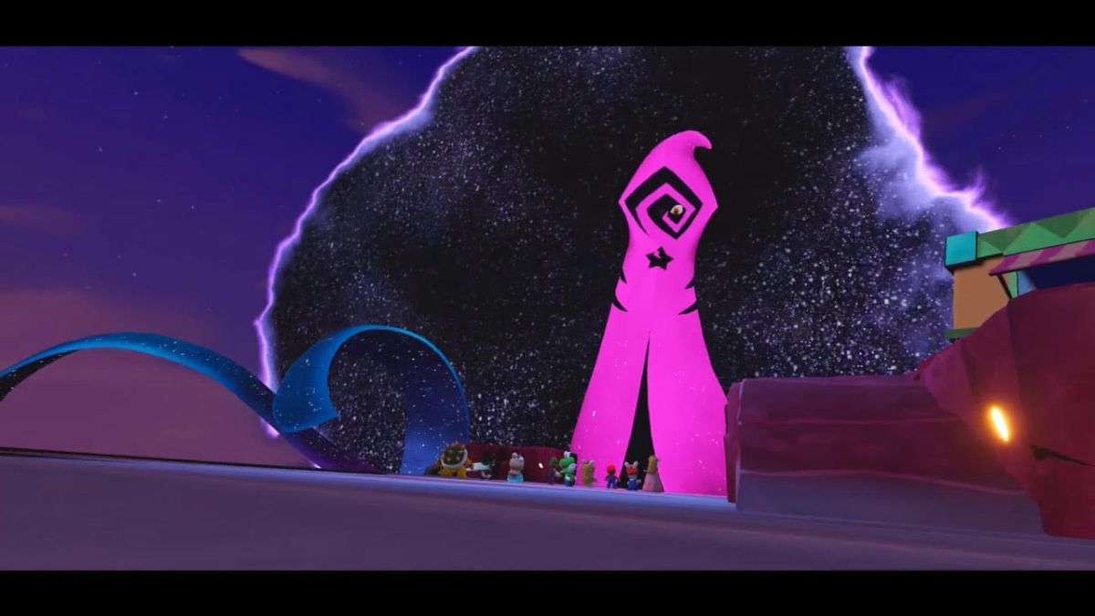 A screengrab from Mario + Rabbids: Sparks of Hope, showing Cursa's giant slender pink hooded form standing imposingly over the characters
