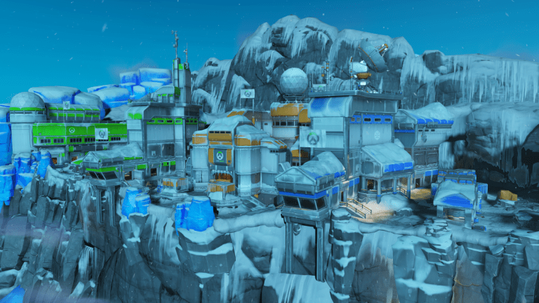 A screenshot of Antarctic Peninsula, in which a collection of buildings sit atop a snowy side of a cliff