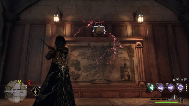 A player in a long blue and gold robe looking at a button with a white outline over a map of Argyllshire in Hogwarts Legacy.