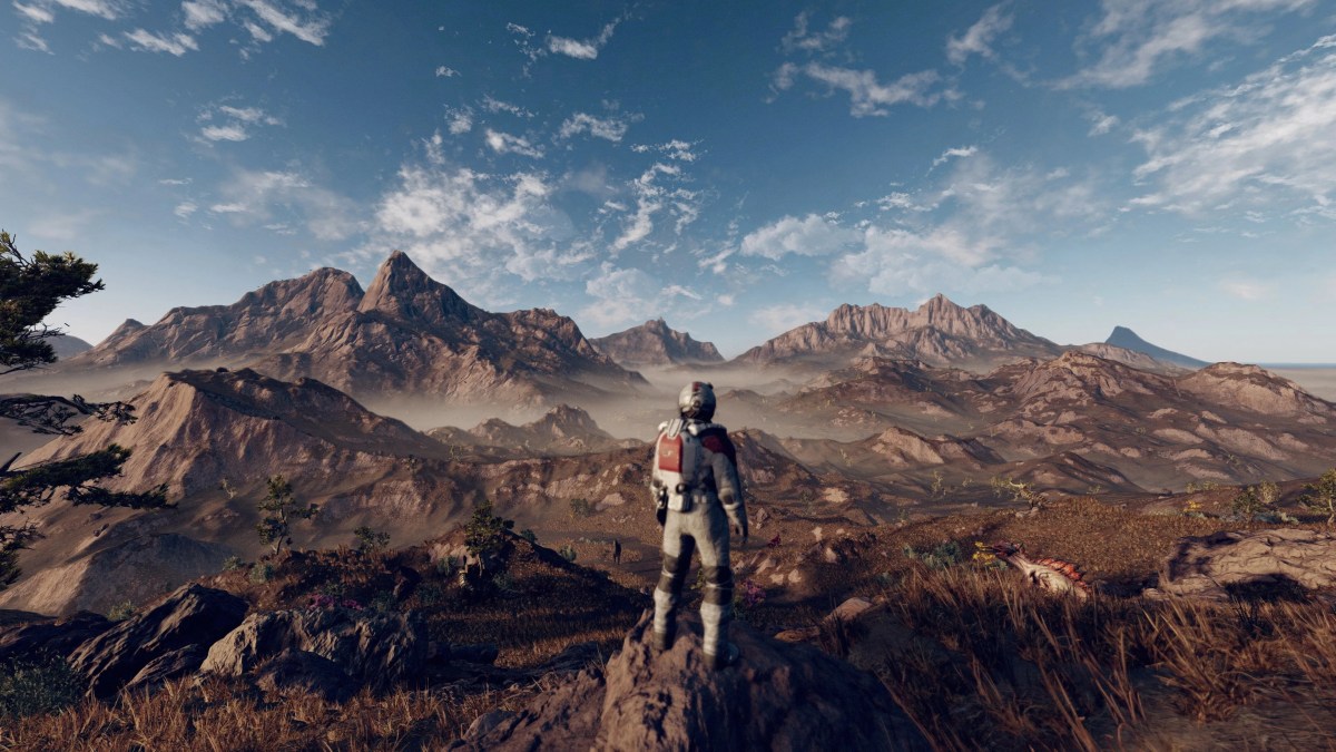 Starfield astronaut looks over barren landscape