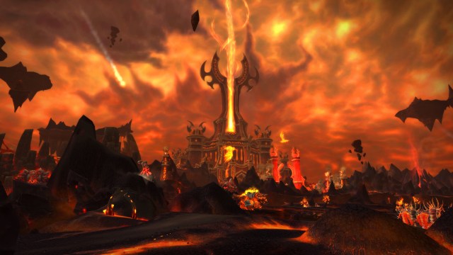 A hellscape of fire and rock with a tower firing a beam of red energy in the sky in WoW: Cataclysm.