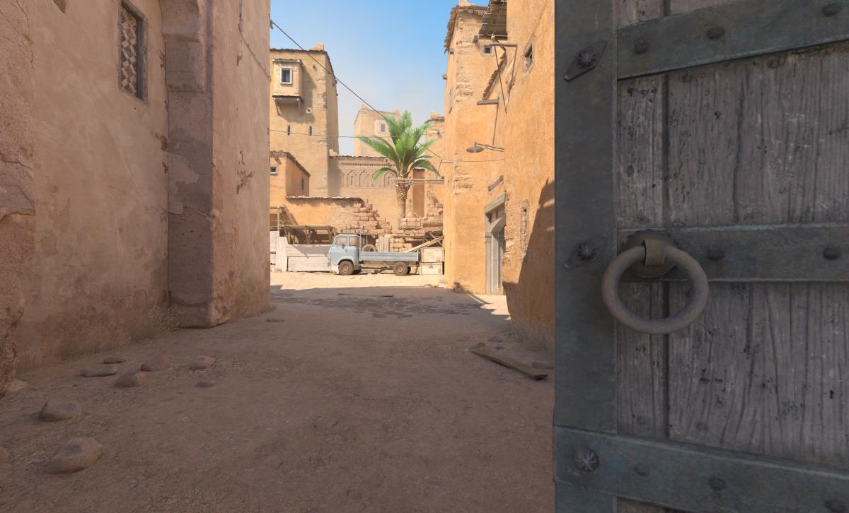 A peek through double doors mid on Dust 2 in CS2.