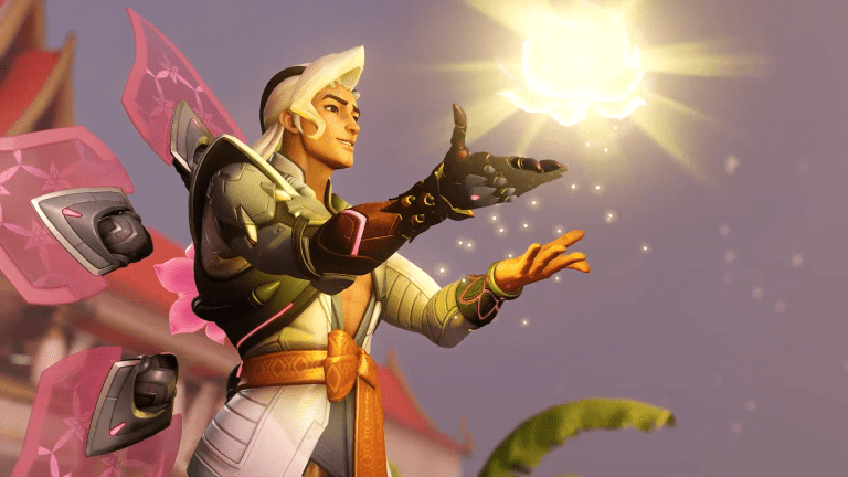 Lifeweaver from Overwatch 2 extends his hands and a bright orb of yellow light emerges from them.