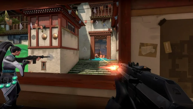 A player aims their gun and fires alongside their teammate, Sage, on the Japanese-themed Haven in VALORANT.