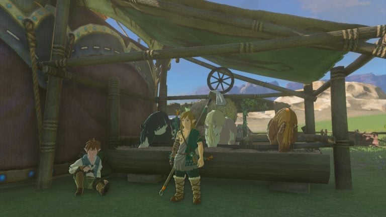 A screenshot from TOTK shows Link standing in front of two horses, a white one and a brown one.