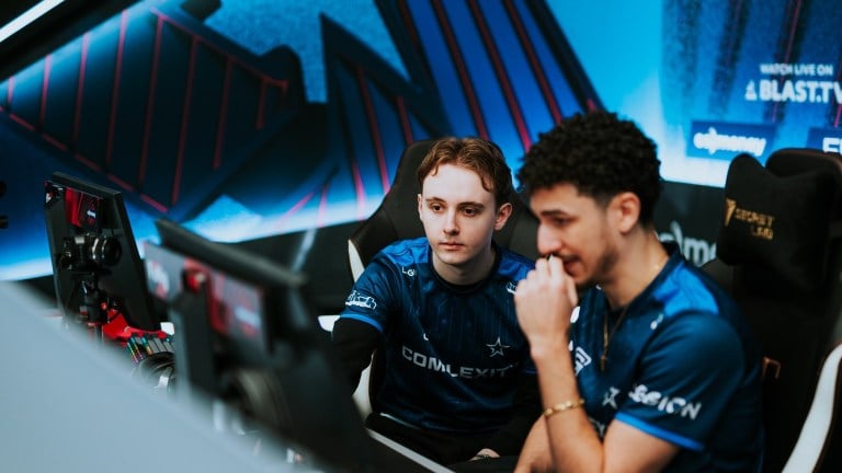 Two professional CS:GO players looking at one monitor during BLAST Premier Spring Groups in 2023.