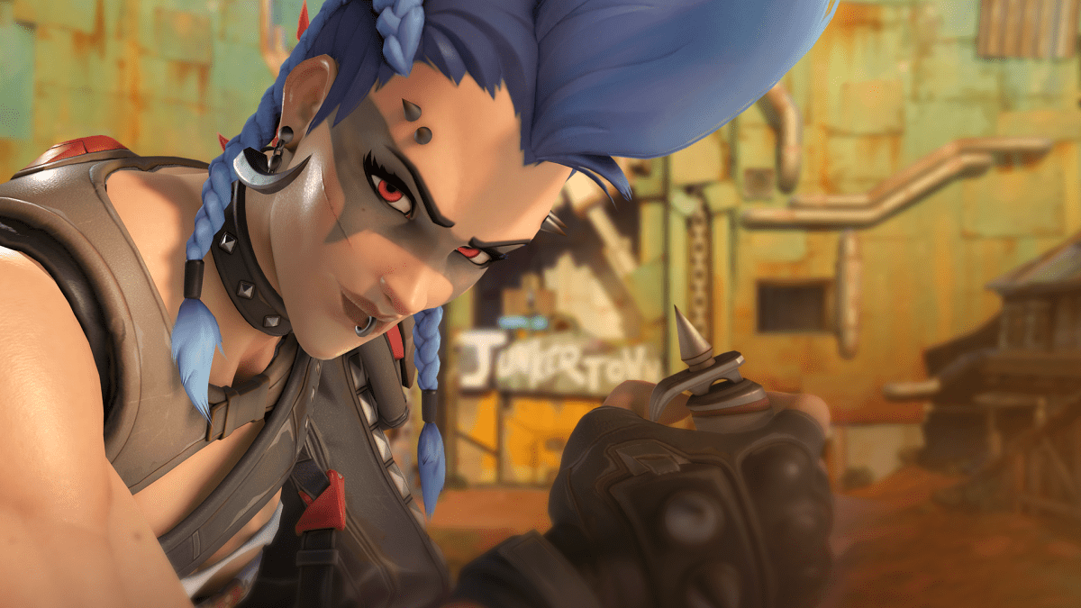 Junker Queen stares seriously at the camera during a closeup while holding her Jagged Blade.