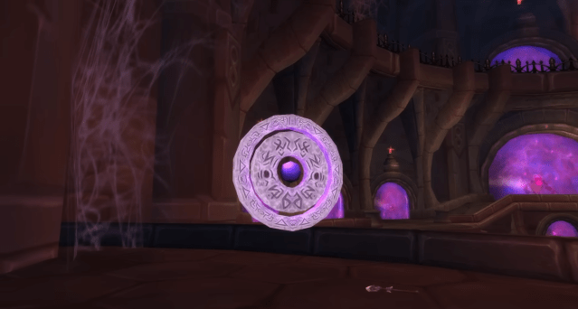 A rune-covered purple titan rune sits just beyond the entrance to the Violet Hold dungeon in WoW Wrath of the Lich King Classic