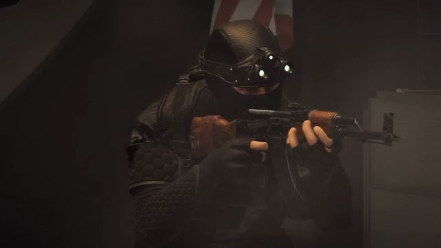 An Echelon spy in XDefiant wielding an AK47 in the darkness.
