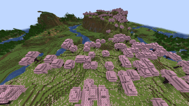 A cherry blossom biome that spans over two mountains in Minecraft.