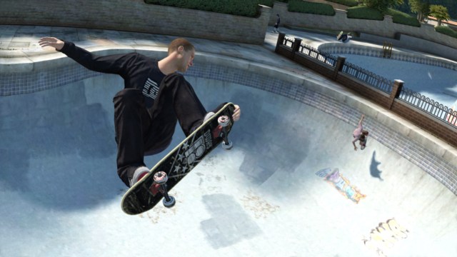 A Skate 3 character does an aerial trick in a drained swimming pool