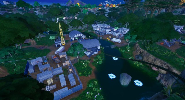 A screenshot of Creeky Compound, a cluster of research buildings separated by a river.