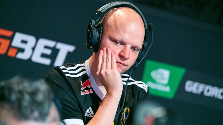 Vitality's CS:GO coach XTQZZZ. He's a bald white male using a headset.