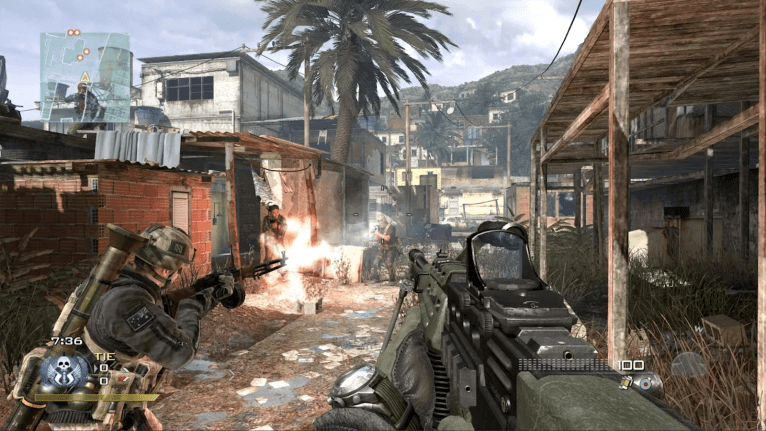 A character fires a weapon alongside an ally down a pathway lined with buildings, with a Brazilian favela and mountain in the background in Call of Duty: Modern Warfare 2 (2009).