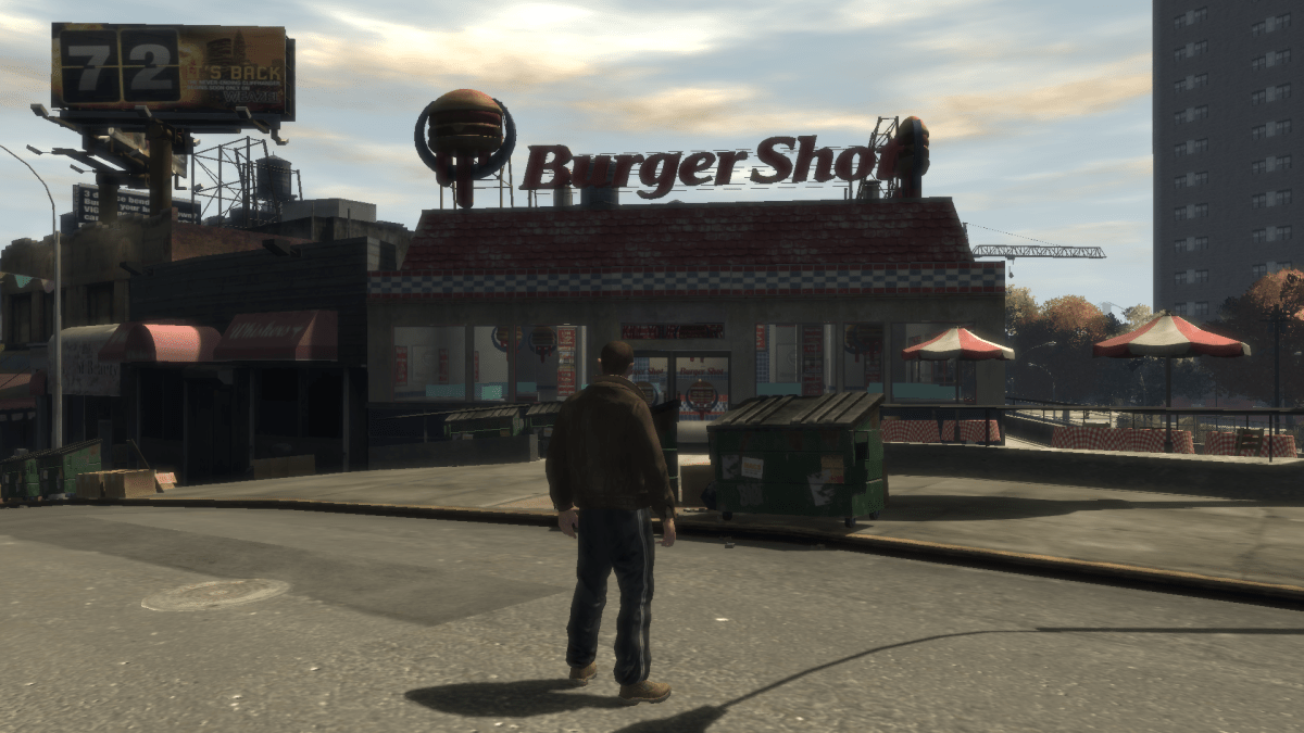 GTA IV protagonist Niko about to enter a Burger Shot store in Bohan.