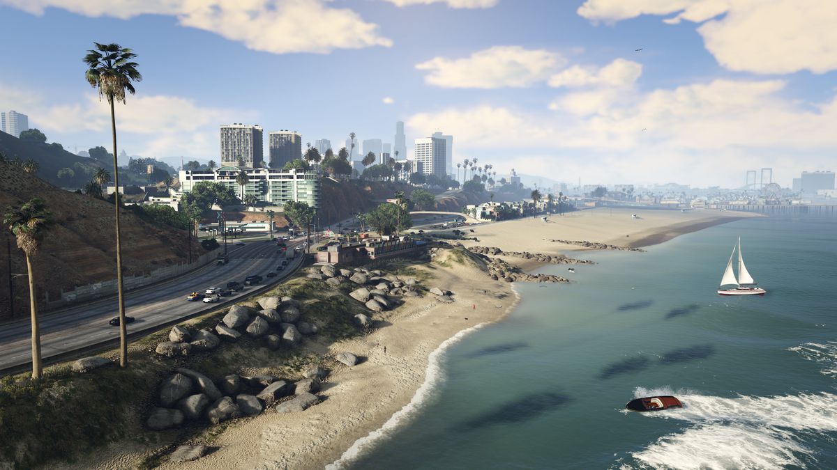 One of the beaches in GTA V, some tall palmtrees, and several buildings at distance.