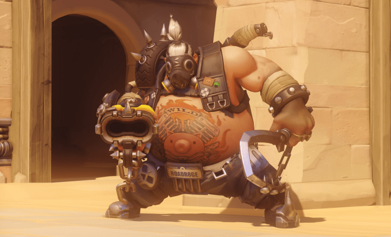 Roadhog in Overwatch 2, standing in front of a doorway holding his iconic shotgun and hook.