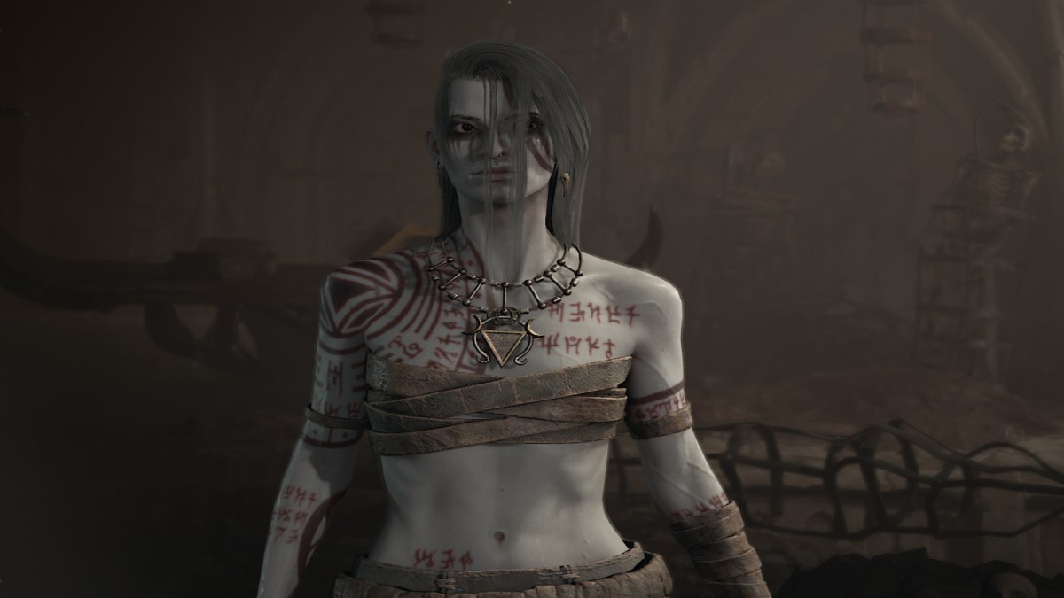 The character creation screen in Diablo 4, showing a female necromancer with off-white skin covered in tattoos.