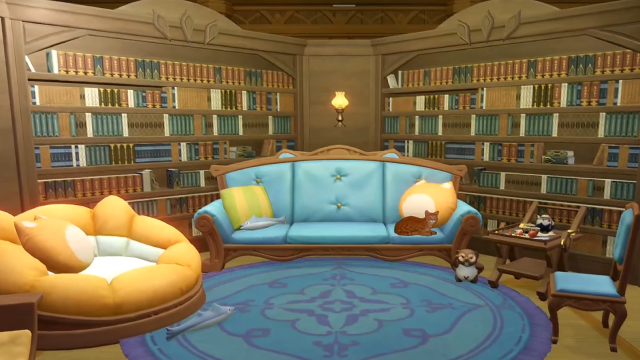 A cozy cat room with bookshelves, a couch, a side table, a chair, and a massive cat bed. 