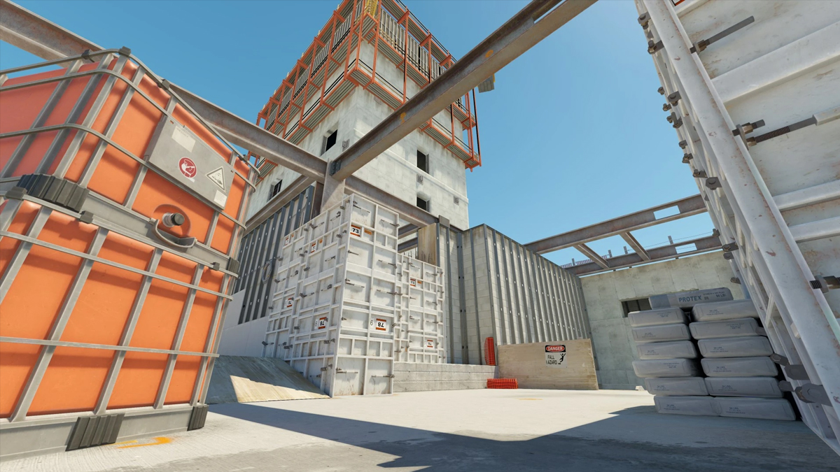 A construction site takes shape on top of a highrise building with beams and concrete bags on Vertigo in Counter-Strike.