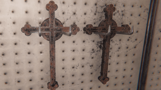 Two Crucifixes hanging on a wall.