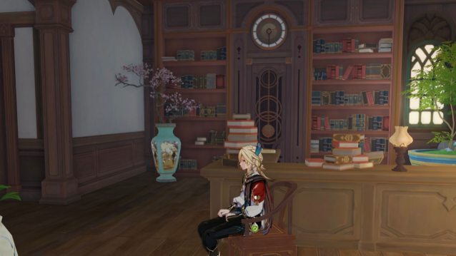 Kaveh sitting on a chair in a Howl's Moving Castle replica.