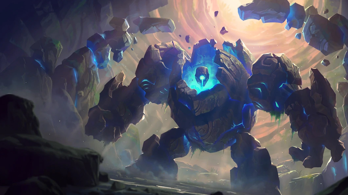 A gigantic rock golem, with a blue glow from beneath its head, stands ready for a fight as rocks fly around it in League of Legends.