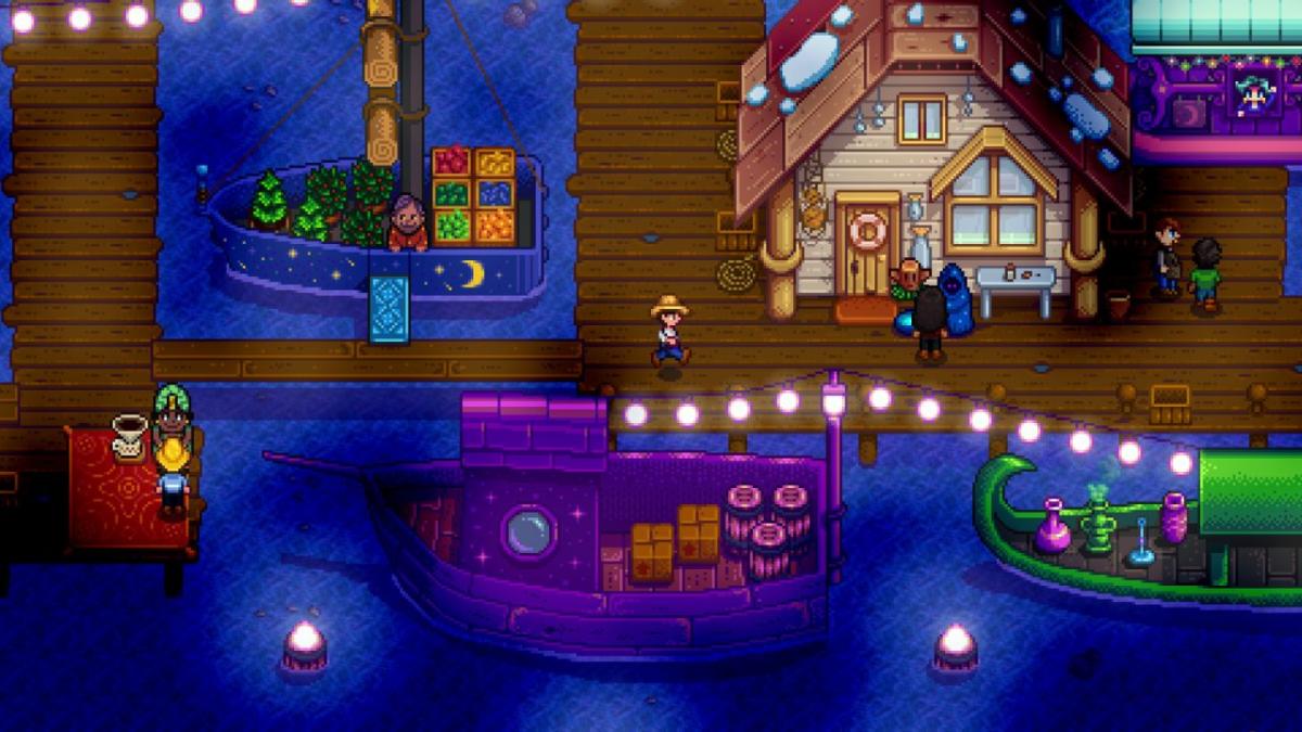 A pixelated town at night with string lights, people, houses, and boats in Stardew Valley
