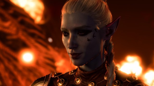 Baldur's Gate elf smirking with fire behind her