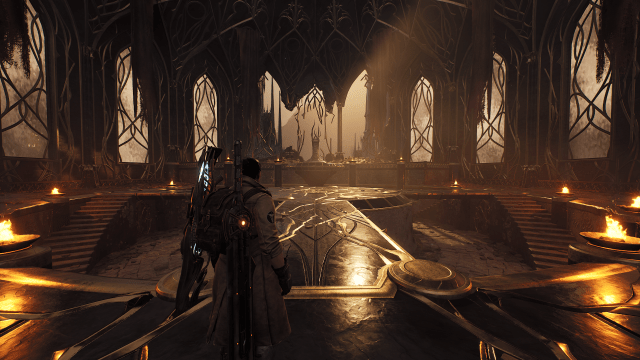 An explorer looking at The Red Prince's throne room in Remnant 2.