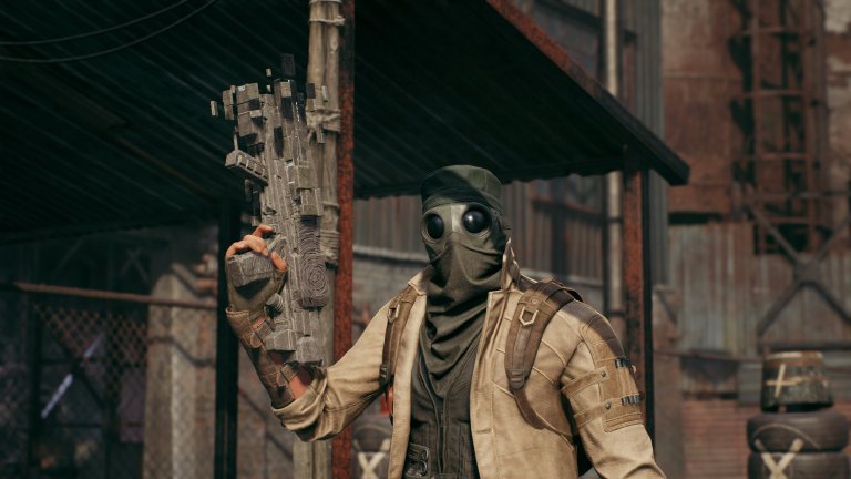 A Medic player holding up the Enigma hand gun in Remnant 2.