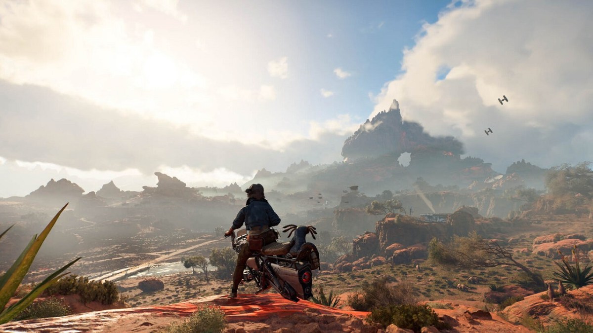 There is a character in the center on a speeder bike in an vast desert. There are bushes in the distance and clouds in the air far away.