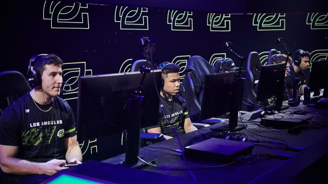 A photo of five OpTic Gaming Los Angeles players focused on their monitors.