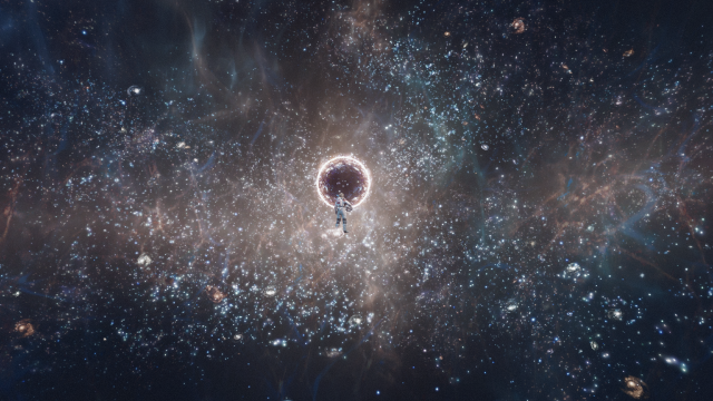 Image of the vast expanse of space. In the center of the frame stands a lone man in an astronaut uniform standing in front of an ominous black sphere.