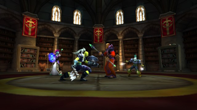 A group of WoW Classic characters face off in battle in the Scarlet Monastery Library