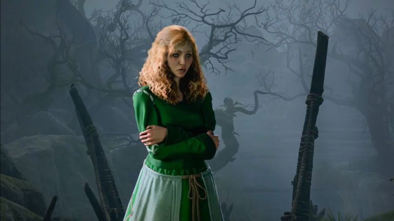 Woman in green dress hugging herself in front of an eerie background in BG3