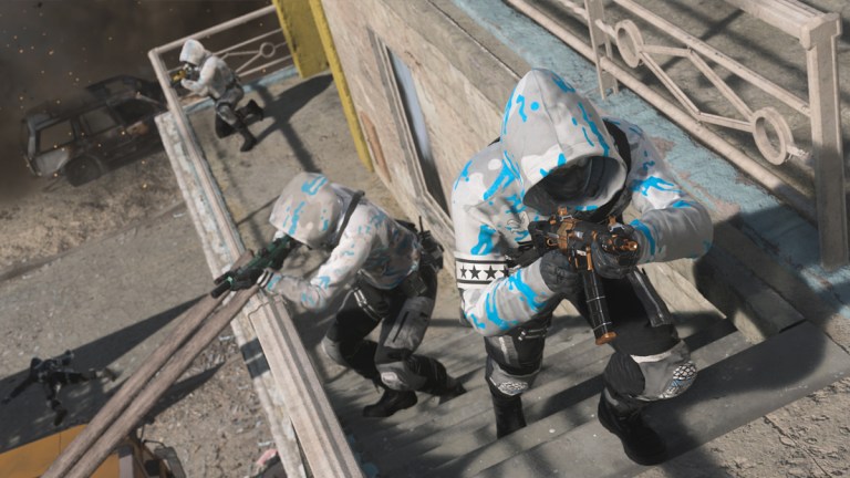 Soldiers in white and blue hoodies move as a team up stairs in an active warzone in DMZ.