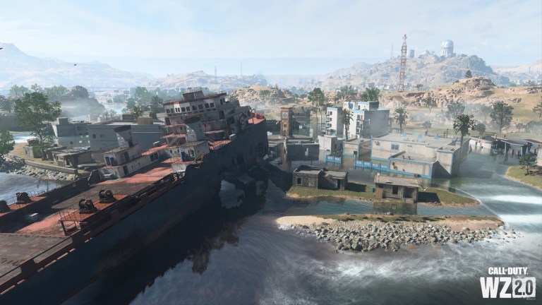 An oil tanker grounded nearby a small village, with an observatory on a hill in the distance on Al Mazrah in Call of Duty's DMZ.