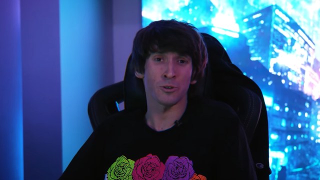 Dota 2 player Dendi sits at his PC answering questions about his team.