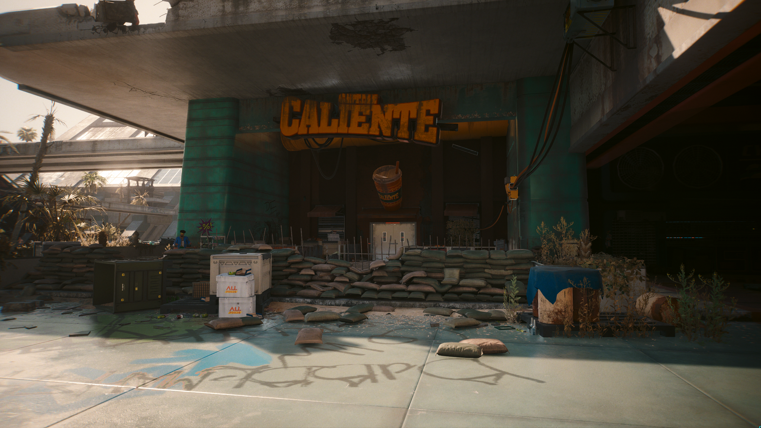 A decaying restaurant with the Capitan Caliente sign in Cyberpunk 2077.