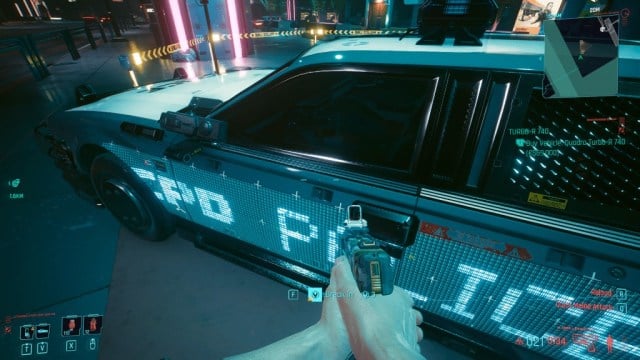 Breaking into a cop car in Cyberpunk 2077.