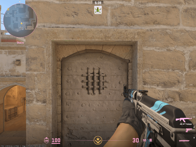 Desktop FOV in CS2 mirage with an ak47 looking at a door attached to a wall