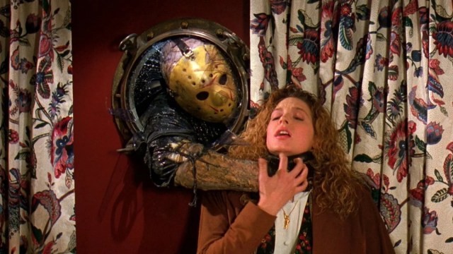 Jason Voorhees from Friday the 13th attacking a woman