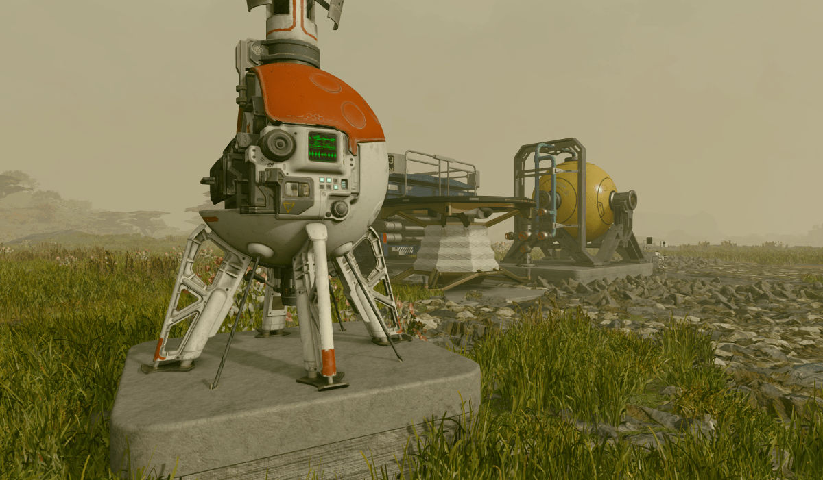 An outpost beacon, a spherical red and white orb with an antenna sticking out of it, sits in front of a foggy and hilly landscape.