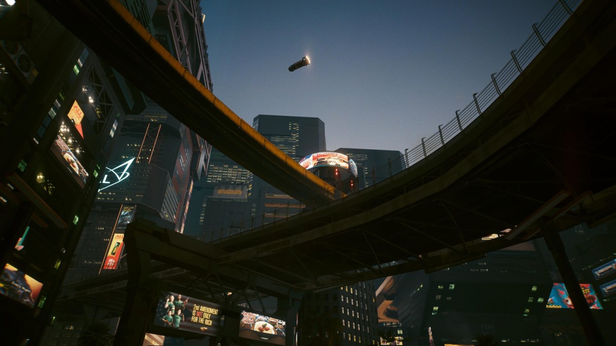 An in game screenshot of Night City from the game Cyberpunk 2077.